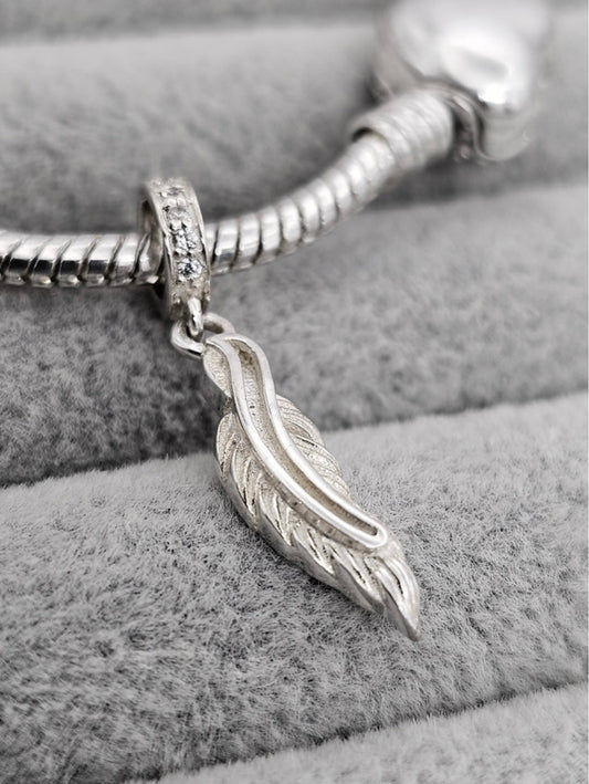 Feather dangle charm
