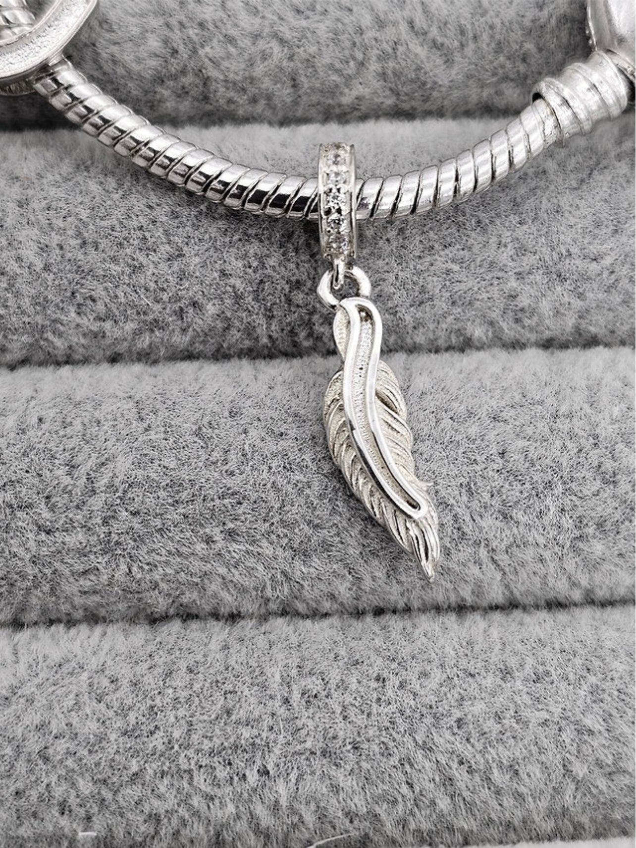 Feather dangle charm