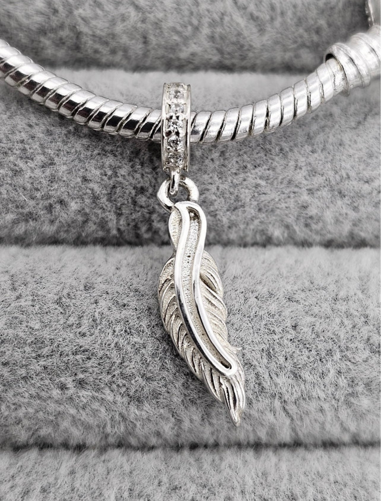 Feather dangle charm