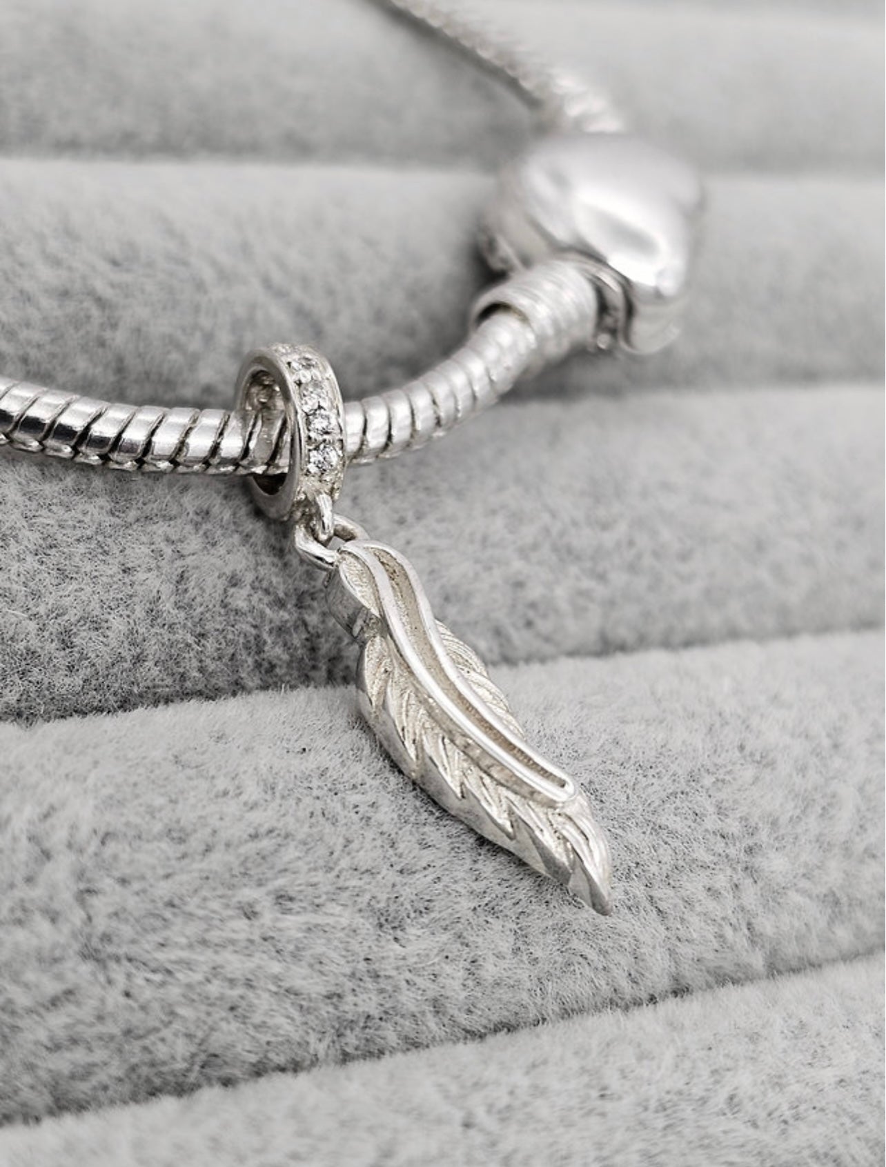 Feather dangle charm