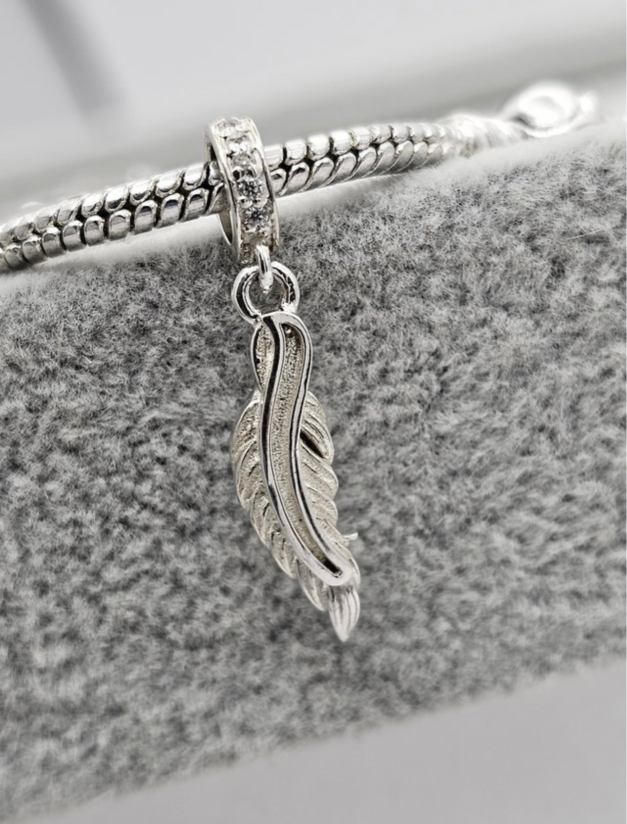 Feather dangle charm